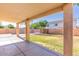 Covered back patio featuring concrete flooring and views of the backyard and pool at 2880 E Nunneley Rd, Gilbert, AZ 85296