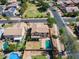 Backyard aerial view features a large pool, green lawn, trees and landscaped yard at 2880 E Nunneley Rd, Gilbert, AZ 85296