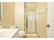 Cozy bathroom features a framed mirror, toilet, and a separate shower with a gold-trimmed glass door at 2880 E Nunneley Rd, Gilbert, AZ 85296