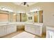 Primary bathroom with double sink vanity, large mirrors, and tile floors at 2880 E Nunneley Rd, Gilbert, AZ 85296