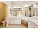 Bright bathroom with double sinks, vanity, tile floors, and large mirror at 2880 E Nunneley Rd, Gilbert, AZ 85296