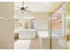 Bright primary bathroom with soaking tub, glass shower and double sink vanity at 2880 E Nunneley Rd, Gilbert, AZ 85296