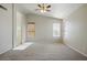 Bedroom featuring vaulted ceiling with ceiling fan and two windows for ample natural light at 2880 E Nunneley Rd, Gilbert, AZ 85296