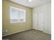 Comfortable bedroom with soft carpet, a bright window, and a closet with sliding doors at 2880 E Nunneley Rd, Gilbert, AZ 85296