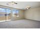 Spacious carpeted bedroom featuring a private balcony and plenty of natural light at 2880 E Nunneley Rd, Gilbert, AZ 85296