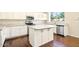Charming kitchen features white cabinetry, stainless steel appliances, granite countertops, and a functional island at 2880 E Nunneley Rd, Gilbert, AZ 85296