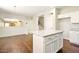 Spacious kitchen with a granite island and modern appliances adjoins a cozy living space at 2880 E Nunneley Rd, Gilbert, AZ 85296