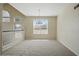 Upstairs landing featuring neutral carpet and many windows at 2880 E Nunneley Rd, Gilbert, AZ 85296