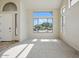 Bright living room with large windows and neutral carpet flooring at 2880 E Nunneley Rd, Gilbert, AZ 85296