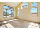 Bright living room featuring vaulted ceilings, and lots of natural light from the many large windows at 2880 E Nunneley Rd, Gilbert, AZ 85296