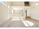 Bright living room featuring vaulted ceilings, a railing to upstairs, and tile/carpet flooring at 2880 E Nunneley Rd, Gilbert, AZ 85296