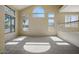 Bright living room featuring vaulted ceilings and large windows at 2880 E Nunneley Rd, Gilbert, AZ 85296