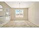 Bright living room featuring vaulted ceilings, a railing to upstairs, and neutral carpet at 2880 E Nunneley Rd, Gilbert, AZ 85296