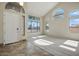Bright living room with large windows and neutral carpet flooring at 2880 E Nunneley Rd, Gilbert, AZ 85296