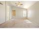 Spacious primary bedroom with vaulted ceilings and natural light, features ceiling fan at 2880 E Nunneley Rd, Gilbert, AZ 85296