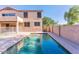 Sparkling pool surrounded by concrete, block wall, and views of the home's exterior at 2880 E Nunneley Rd, Gilbert, AZ 85296