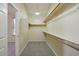 Walk-in closet featuring shelving for organization and plush carpeting at 2880 E Nunneley Rd, Gilbert, AZ 85296