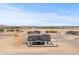 Aerial view of the home and surrounding lots in a growing rural community at 300 S Charleston Ct, Casa Grande, AZ 85194