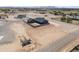 Aerial view of a home with gray paint, block wall and large lot at 300 S Charleston Ct, Casa Grande, AZ 85194