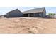 View of the backyard with covered patio on this newly constructed home at 300 S Charleston Ct, Casa Grande, AZ 85194