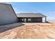 A house has a covered patio area with gray exterior paint and wooden pillars at 300 S Charleston Ct, Casa Grande, AZ 85194