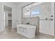 Luxurious bathroom features a freestanding tub and a glass-enclosed shower with stunning marble accents at 300 S Charleston Ct, Casa Grande, AZ 85194