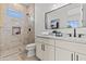 Stylish bathroom featuring a walk-in shower, a sleek vanity, and modern fixtures at 300 S Charleston Ct, Casa Grande, AZ 85194