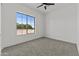 A neutral bedroom with carpet flooring and a large window for ample natural light at 300 S Charleston Ct, Casa Grande, AZ 85194