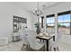 Bright dining room features a modern chandelier and a dining table with seating for six at 300 S Charleston Ct, Casa Grande, AZ 85194