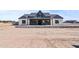Charming single-story home featuring a stone facade, covered entryway, and a well-manicured yard at 300 S Charleston Ct, Casa Grande, AZ 85194