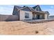 Striking single-story home with a stone facade, covered entrance, and gravel landscaping at 300 S Charleston Ct, Casa Grande, AZ 85194