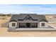 Stunning front exterior with stone and siding details, plus a covered porch at 300 S Charleston Ct, Casa Grande, AZ 85194