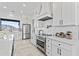 Contemporary kitchen featuring white cabinets, stainless steel appliances, and ample counter space at 300 S Charleston Ct, Casa Grande, AZ 85194