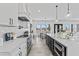 Spacious kitchen featuring white cabinets, stainless steel appliances, and an open layout at 300 S Charleston Ct, Casa Grande, AZ 85194