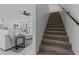 Open living space showcases a modern staircase and bright living room with a large couch at 300 S Charleston Ct, Casa Grande, AZ 85194