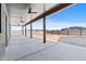 Covered patio with concrete floor, ceiling fans, and timber posts, offering great outdoor living at 300 S Charleston Ct, Casa Grande, AZ 85194