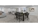 Spacious recreation room features a modern dining set and a large sectional sofa at 300 S Charleston Ct, Casa Grande, AZ 85194