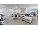 Expansive recreation room with a large sectional sofa, modern accents and ample seating options at 300 S Charleston Ct, Casa Grande, AZ 85194