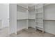 Large walk-in closet featuring built-in shelving and ample storage space, adjacent to the Primary bath at 300 S Charleston Ct, Casa Grande, AZ 85194