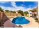 Backyard featuring a kidney shaped pool, desert landscaping and privacy fence at 3132 E Wildwood Dr, Phoenix, AZ 85048