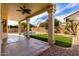 Relaxing covered patio with a view of the pool and the fenced backyard at 3132 E Wildwood Dr, Phoenix, AZ 85048