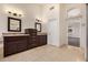 Bathroom with double sink vanity with plenty of counterspace, offering convenience and style at 3132 E Wildwood Dr, Phoenix, AZ 85048