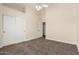 Bedroom with a spacious closet and natural light, creating a comfortable and functional space at 3132 E Wildwood Dr, Phoenix, AZ 85048