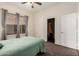 Bedroom featuring a comfortable bed and natural light from the window, creating a welcoming space at 3132 E Wildwood Dr, Phoenix, AZ 85048