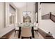 Elegant dining room with modern table set and bright window with shutters at 3132 E Wildwood Dr, Phoenix, AZ 85048