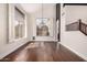 Bright dining area featuring large windows and dark hardwood flooring at 3132 E Wildwood Dr, Phoenix, AZ 85048