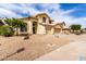 Home with a three-car garage and low-maintenance desert landscaping at 3132 E Wildwood Dr, Phoenix, AZ 85048
