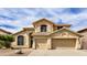 Inviting two-story home showcasing a well-manicured yard and attached two-car garage at 3132 E Wildwood Dr, Phoenix, AZ 85048
