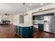 Large kitchen island with granite countertops and stainless steel appliances at 3132 E Wildwood Dr, Phoenix, AZ 85048