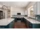 Close-up of a spacious kitchen featuring stainless steel appliances and granite countertops at 3132 E Wildwood Dr, Phoenix, AZ 85048